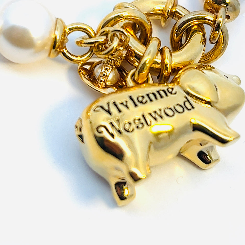 
                      
                        Vivienne Westwood Juanita Gold Tone and Pearl Bracelet
                      
                    