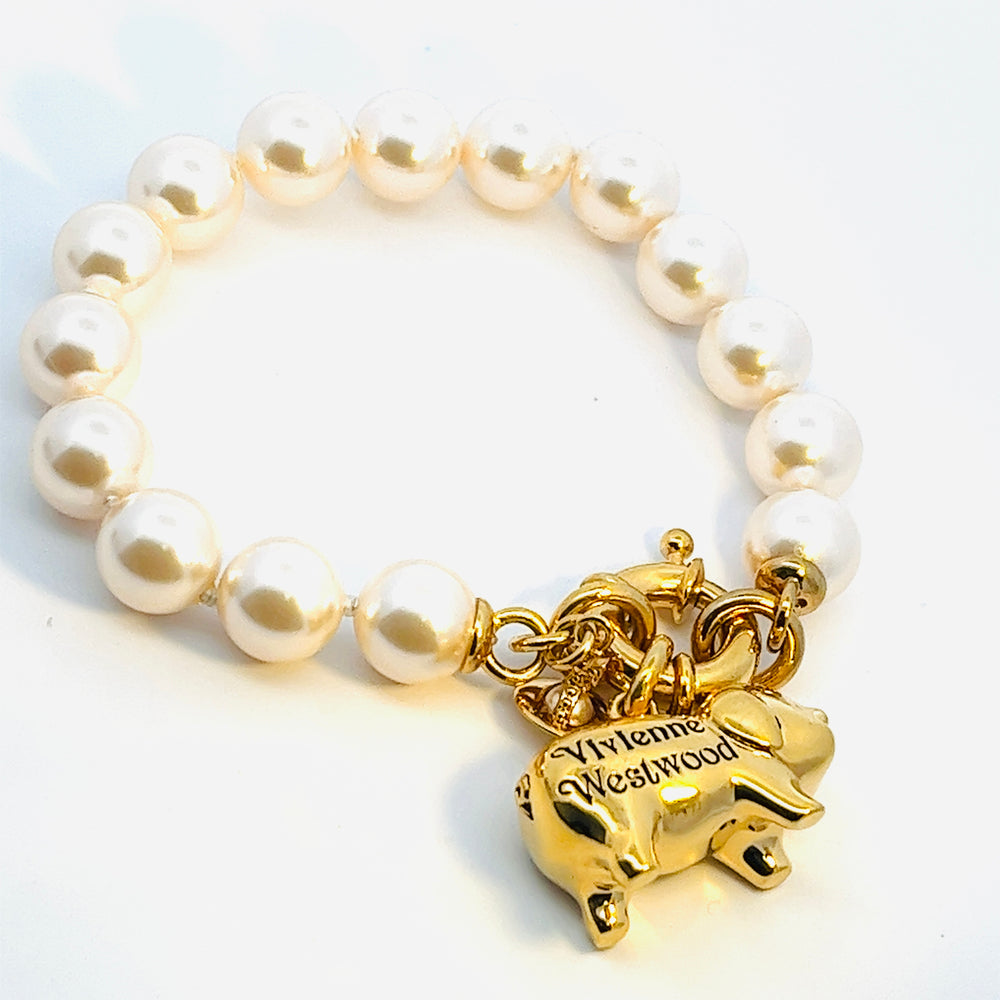 
                      
                        Vivienne Westwood Juanita Gold Tone and Pearl Bracelet
                      
                    