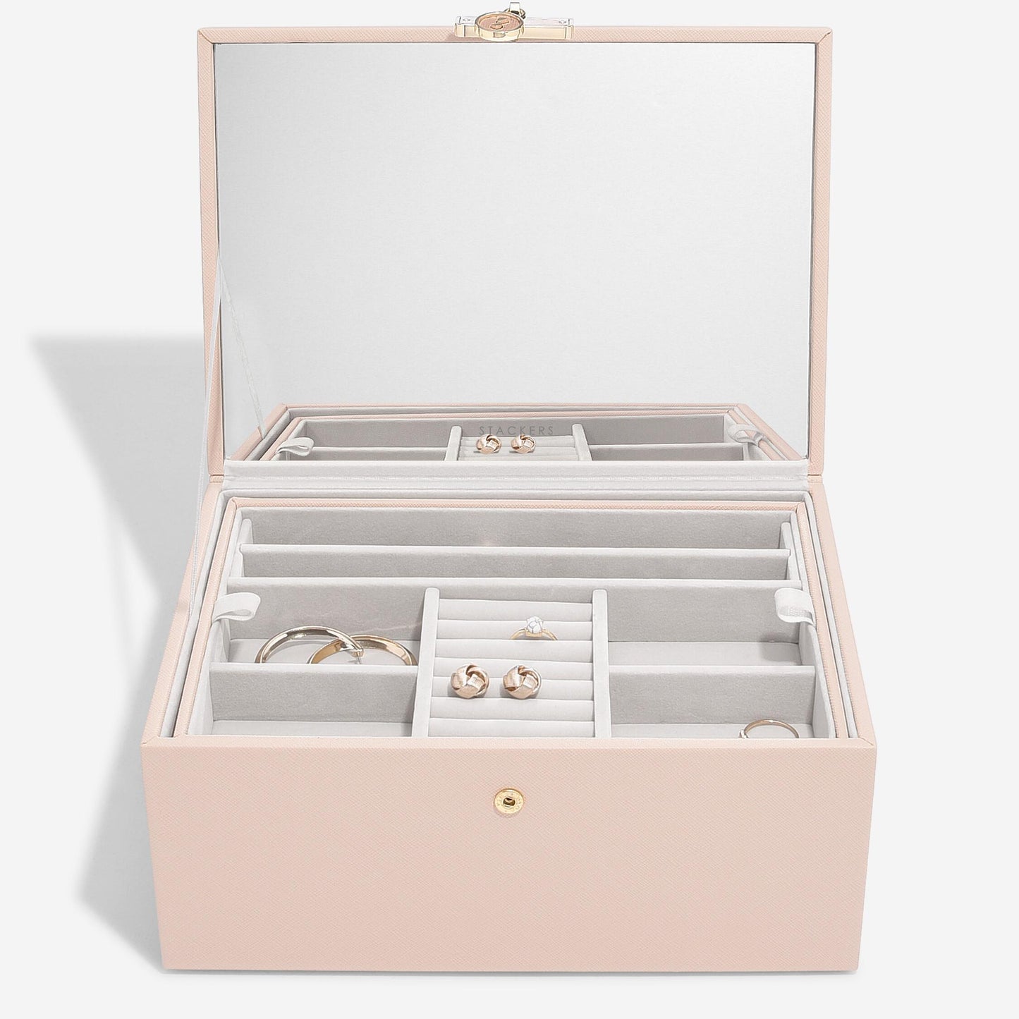 Pink jewelry box with open lid on a white background at Coe and co 