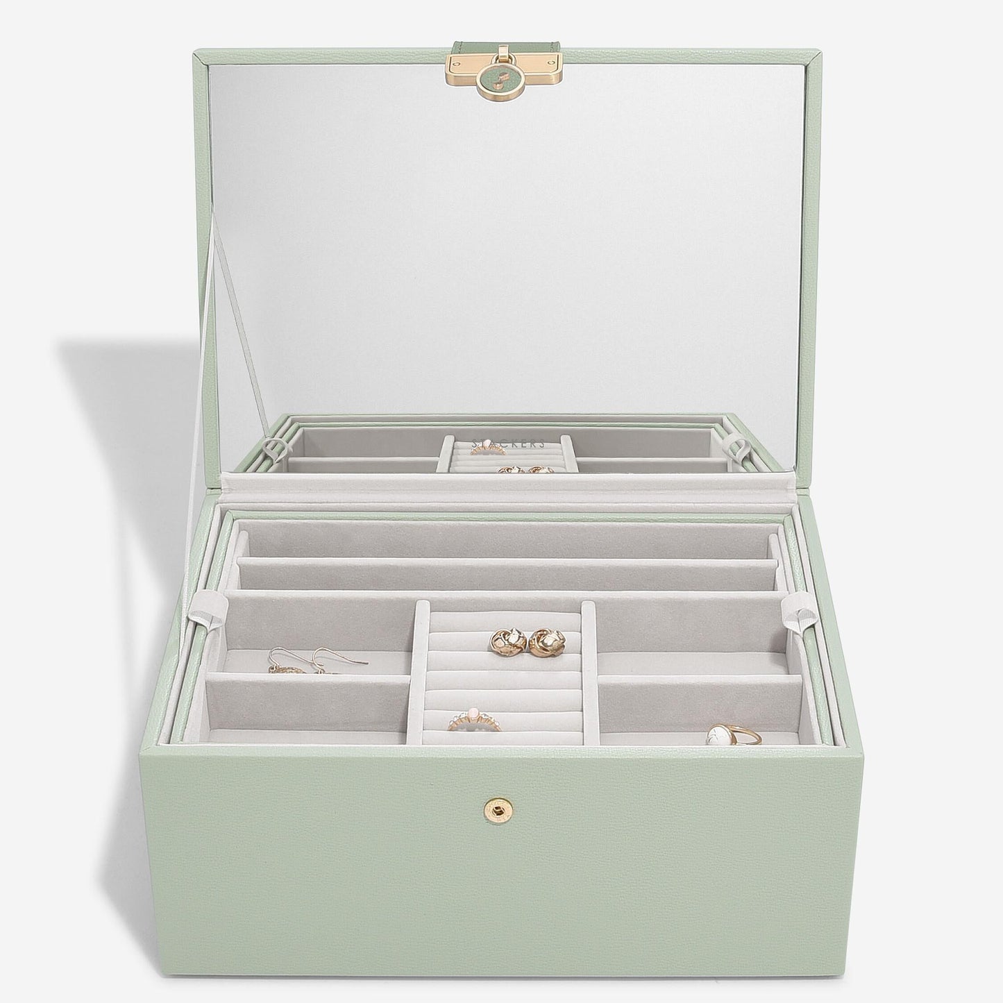 Green jewelry box with clear top on a white background